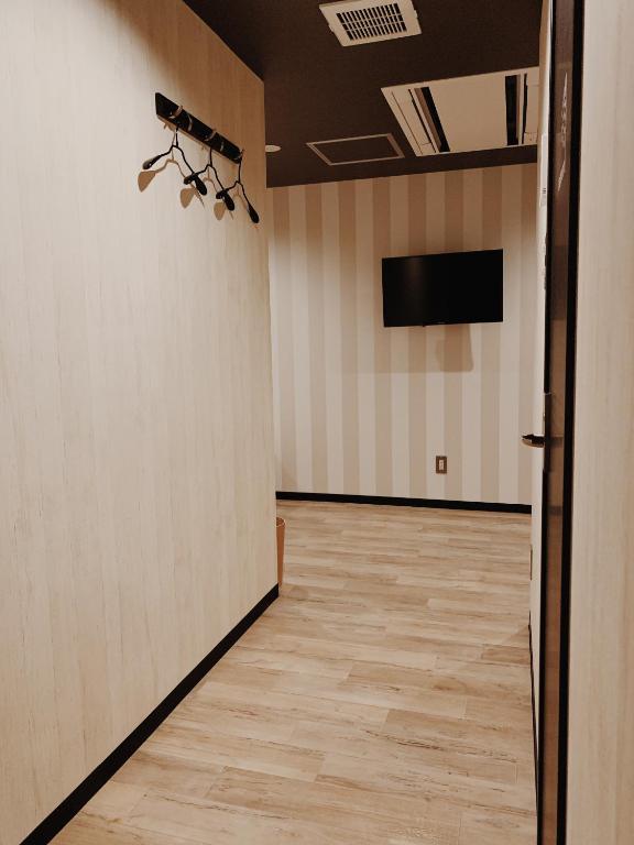 TV a/nebo společenská místnost v ubytování Hotel Capsule Inn Shizuoka