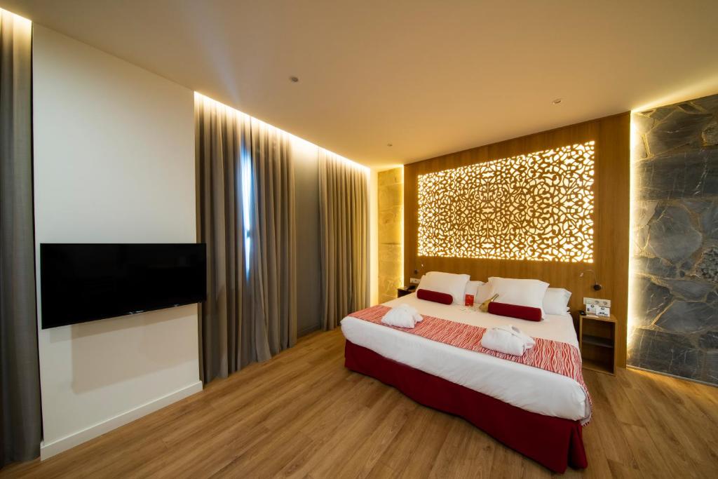 Postel nebo postele na pokoji v ubytování Soho Boutique Capuchinos & Spa