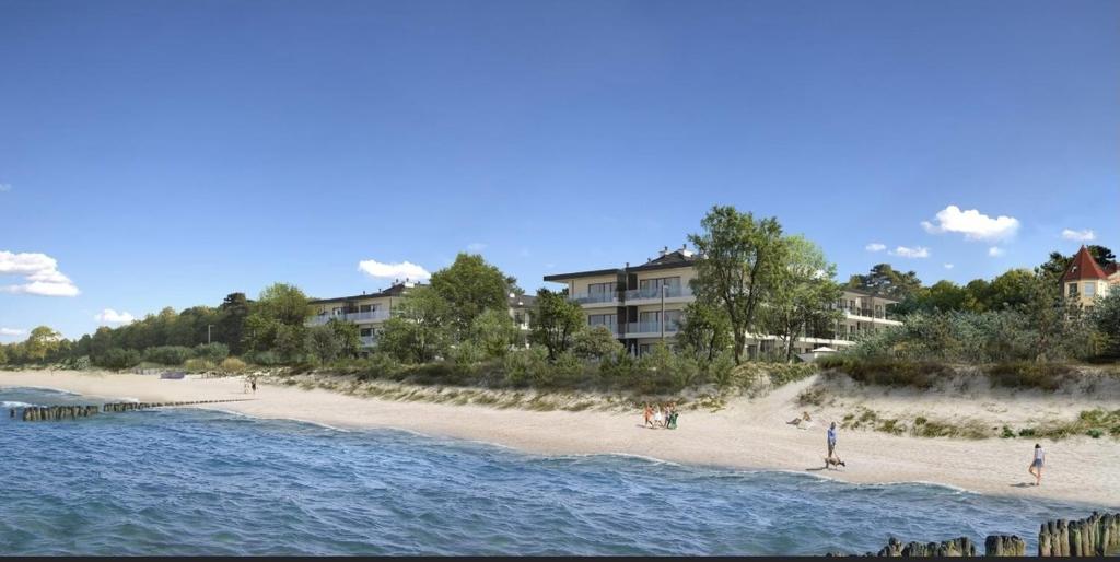 a view of a beach with people on it at Apartament 117 - Rezydencja Niechorze in Niechorze