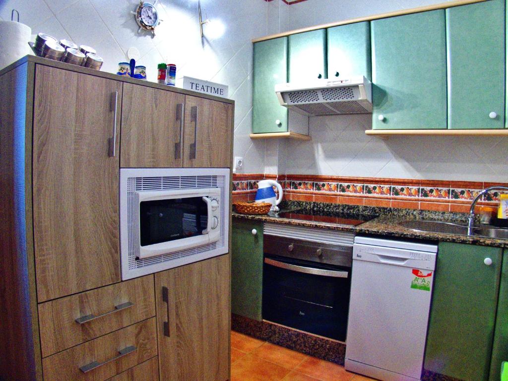 Kuchyň nebo kuchyňský kout v ubytování Villa Raima