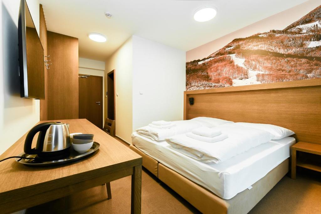 Postel nebo postele na pokoji v ubytování Apartmány Humno