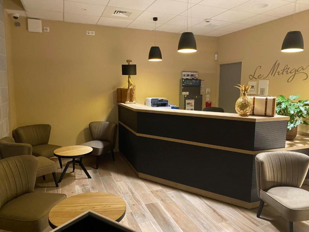 Posezení v ubytování Hôtel - Restaurant Le MITIGANA