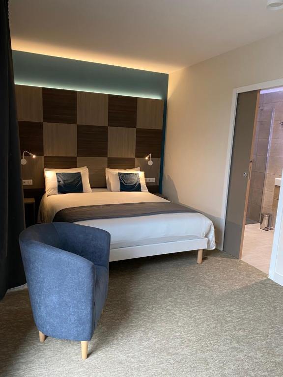 Postel nebo postele na pokoji v ubytování Hôtel - Restaurant Le MITIGANA