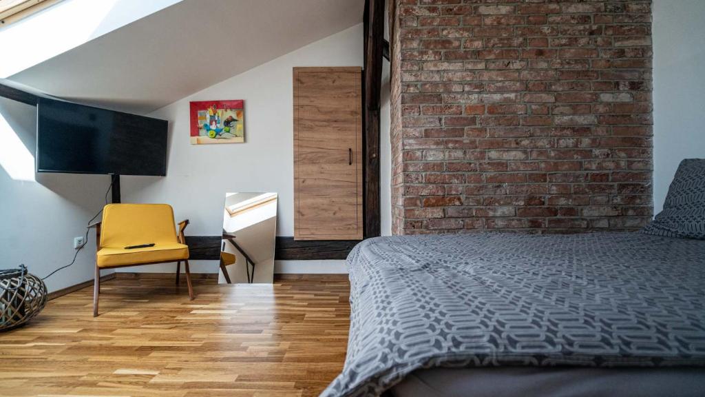 Кровать или кровати в номере Apartament Rynek 22 Krosno