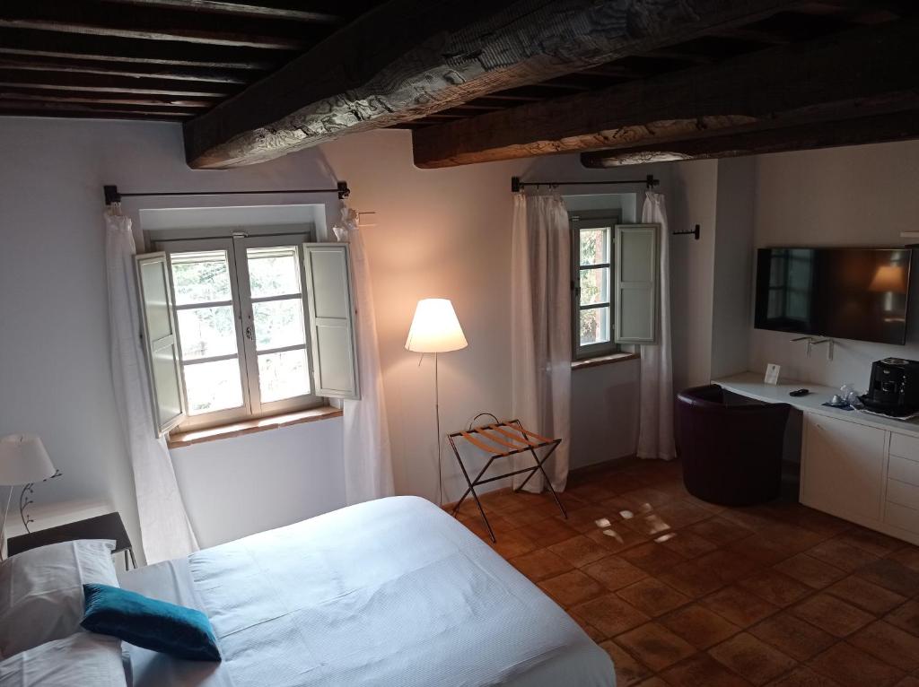 A bed or beds in a room at Locanda Della Picca