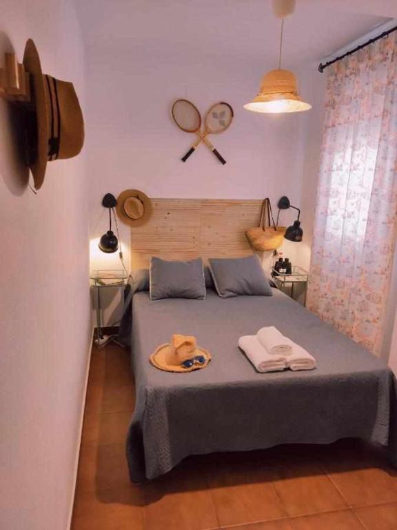 Posteľ alebo postele v izbe v ubytovaní Dos Casas juntas y Patio común a 25 metros de la Playa