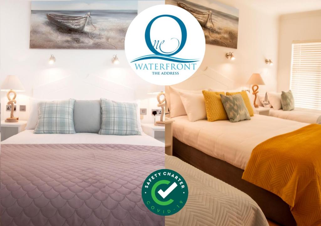 two beds in a bedroom with a sign that reads waterfront the winner at The Addresse on the Beach in Tramore