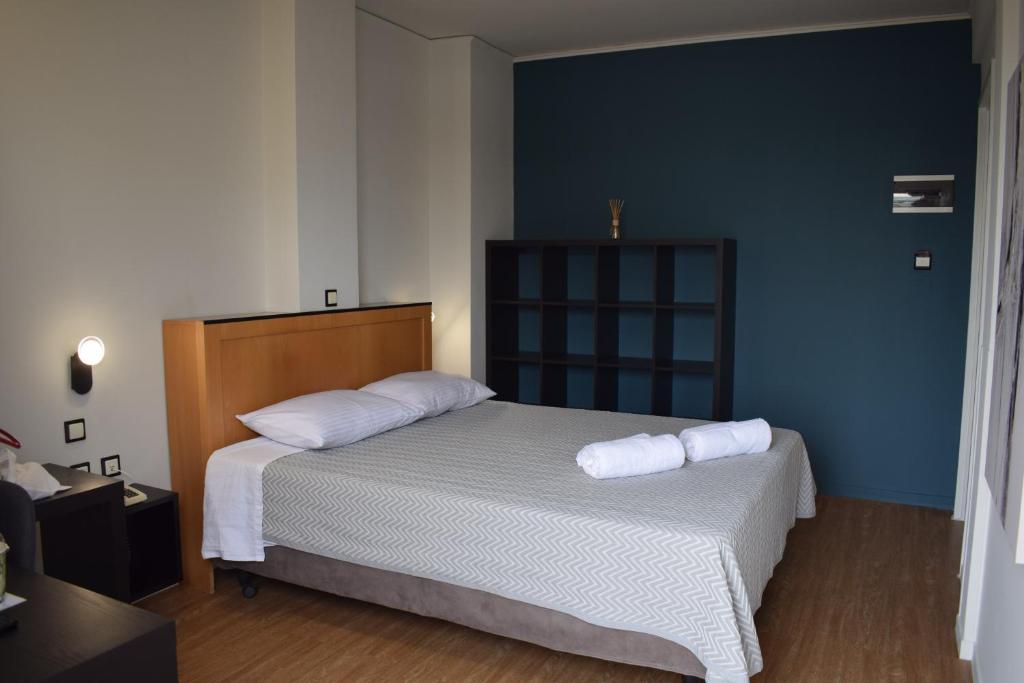 Postel nebo postele na pokoji v ubytování Savoy Hotel