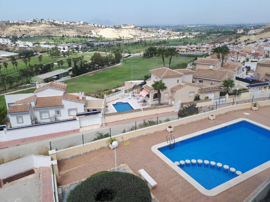 een luchtzicht op een huis met een zwembad bij Golf Club La Marquesa best view ,, Home Aqma ,, in Ciudad Quesada