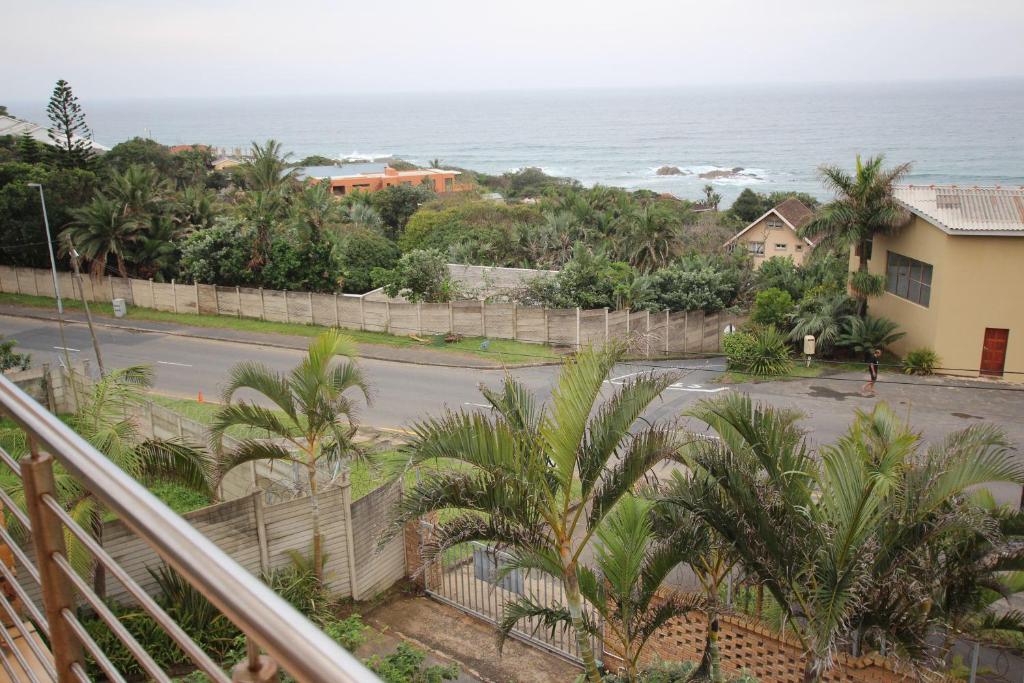 a view of the ocean from the balcony of a house at Surf and Sand - Fish Eagle in Ramsgate