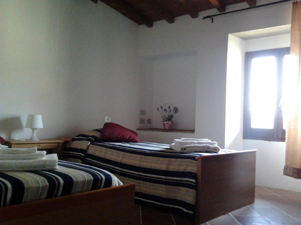 Postel nebo postele na pokoji v ubytování I Granai
