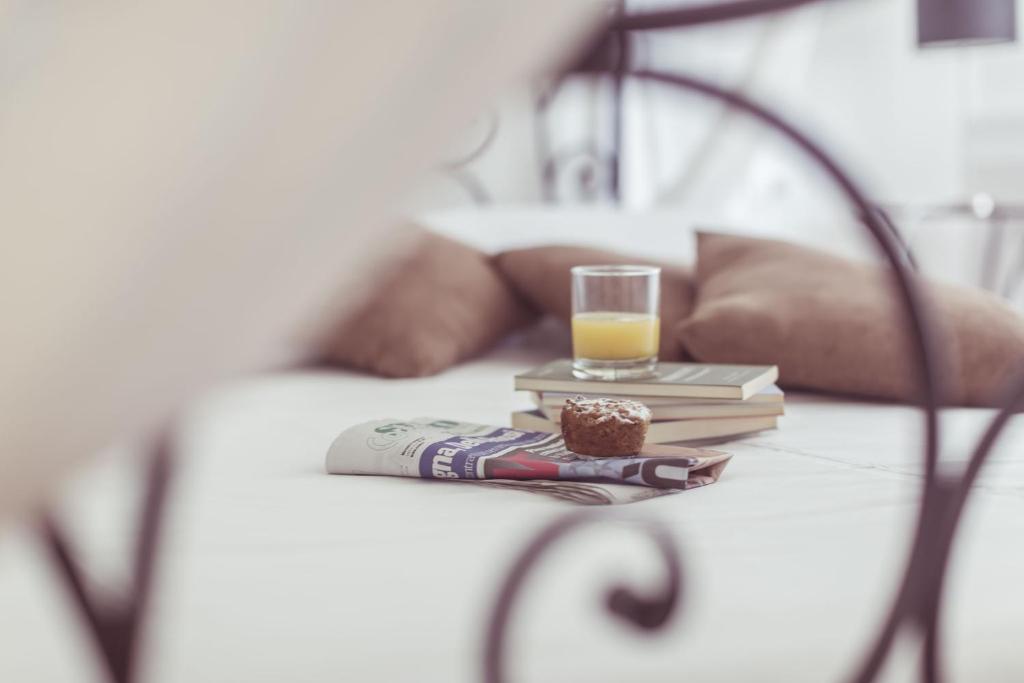 Postel nebo postele na pokoji v ubytování Piccolo Mondo Hotel
