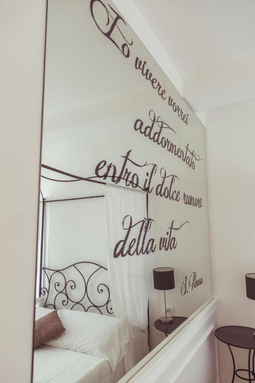 Postel nebo postele na pokoji v ubytování Piccolo Mondo Hotel