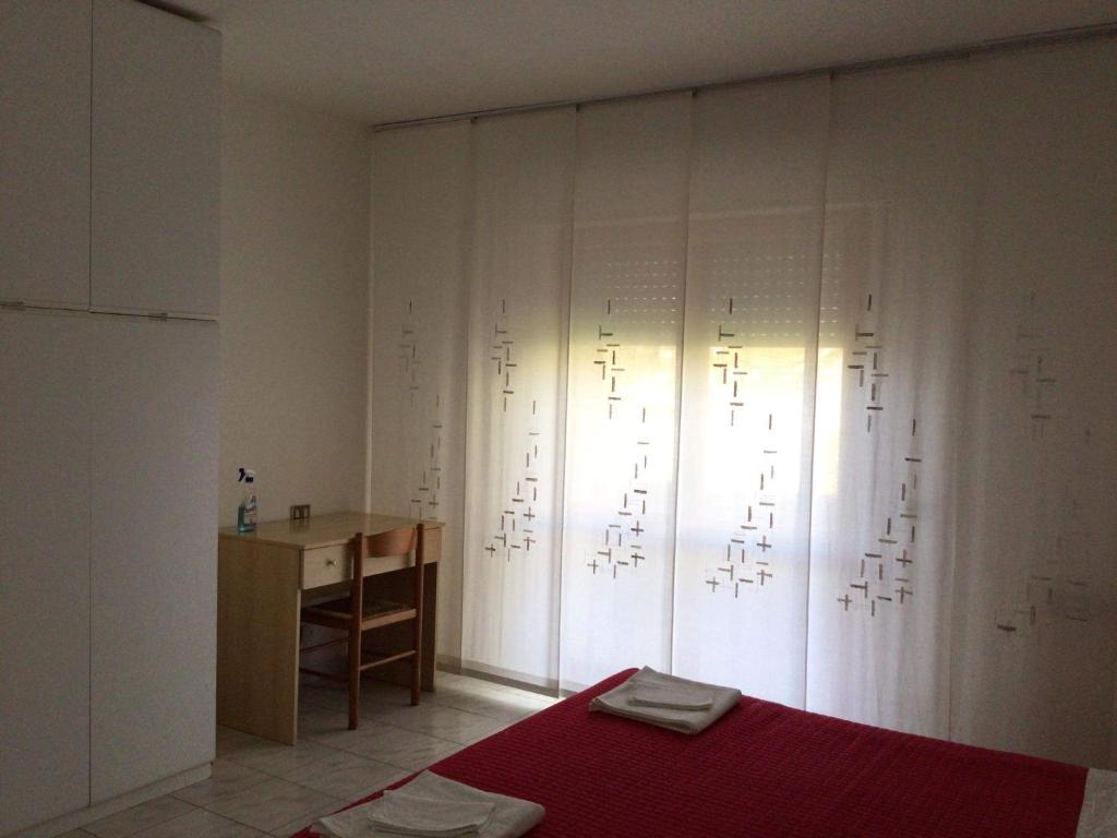 Łóżko lub łóżka w pokoju w obiekcie Appartamento Belvedere