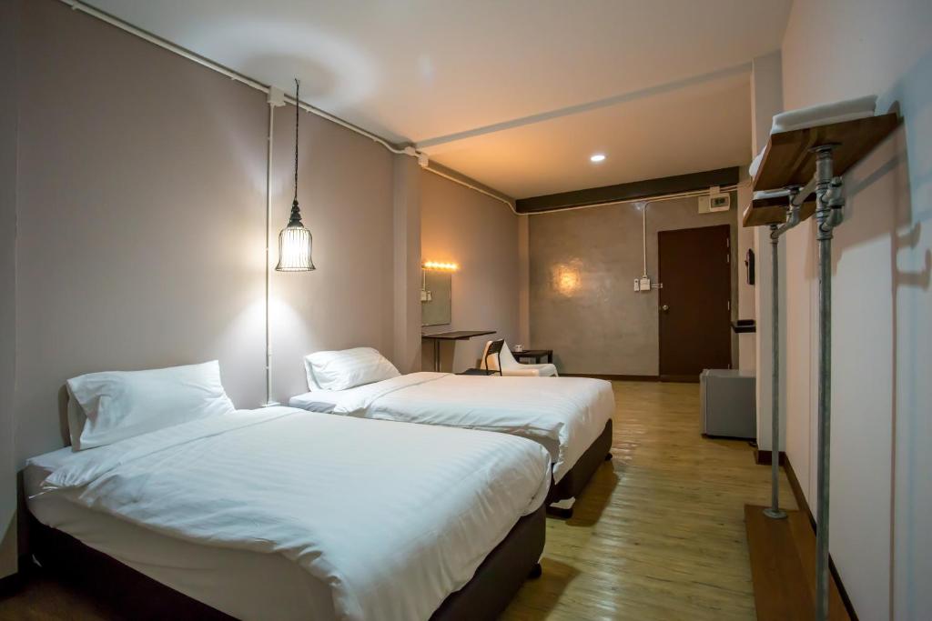 Postel nebo postele na pokoji v ubytování First Residence