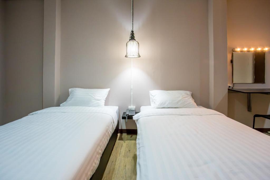 Postel nebo postele na pokoji v ubytování First Residence