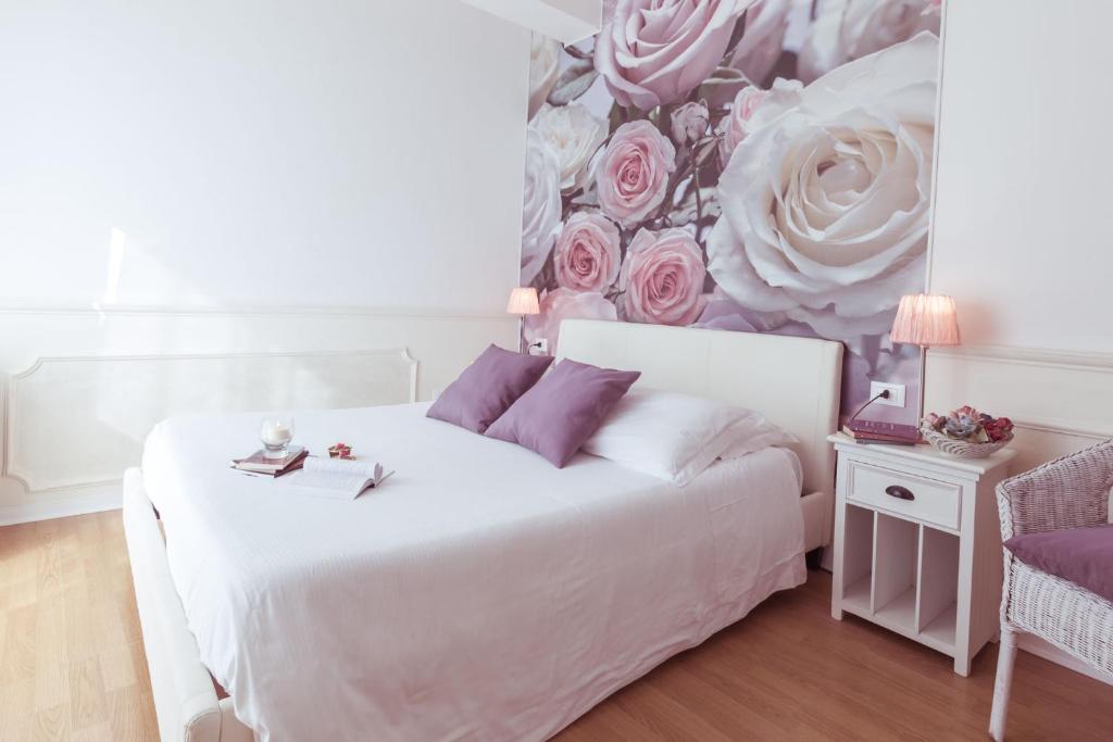 Postel nebo postele na pokoji v ubytování Piccolo Mondo Hotel