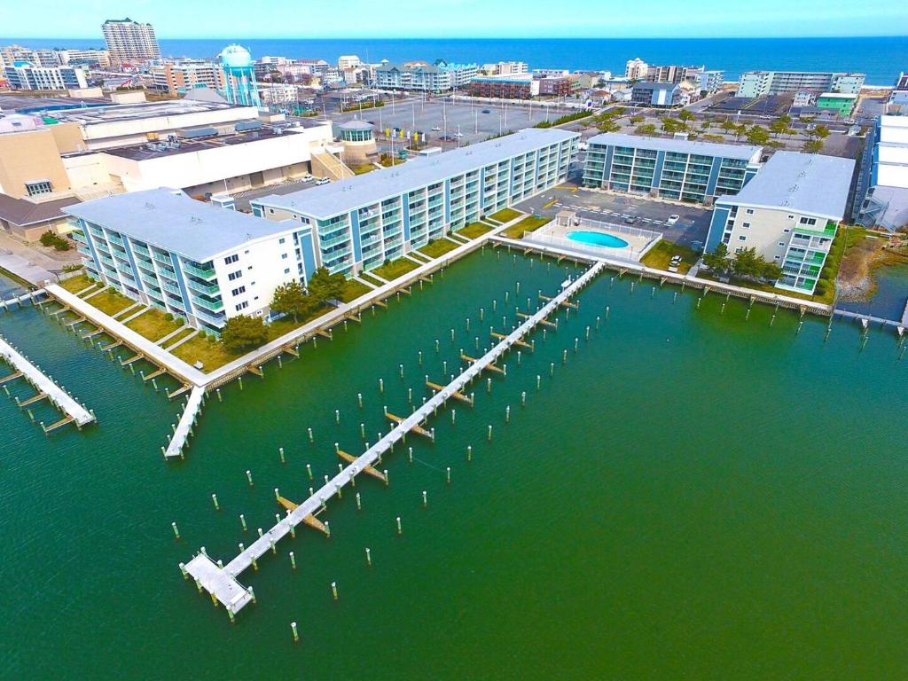 an aerial view of a building with a dock in the water at Thunder Island 75B condo in Ocean City