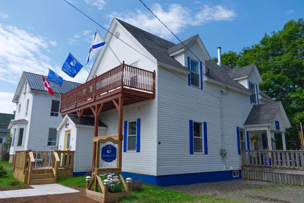 a house with a deck on the side of it at Pleasant Street Inn in Parrsboro