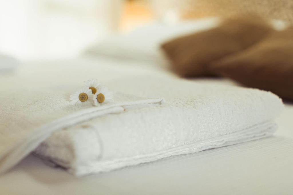 Postel nebo postele na pokoji v ubytování Piccolo Mondo Hotel