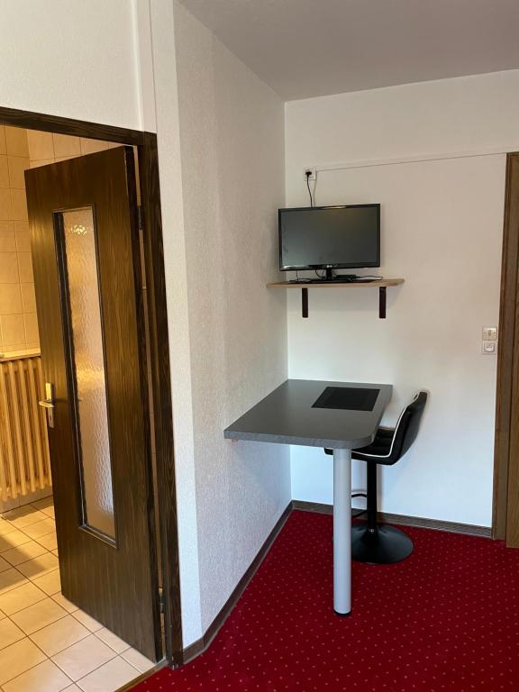 TV a/nebo společenská místnost v ubytování Appartement à l'ange