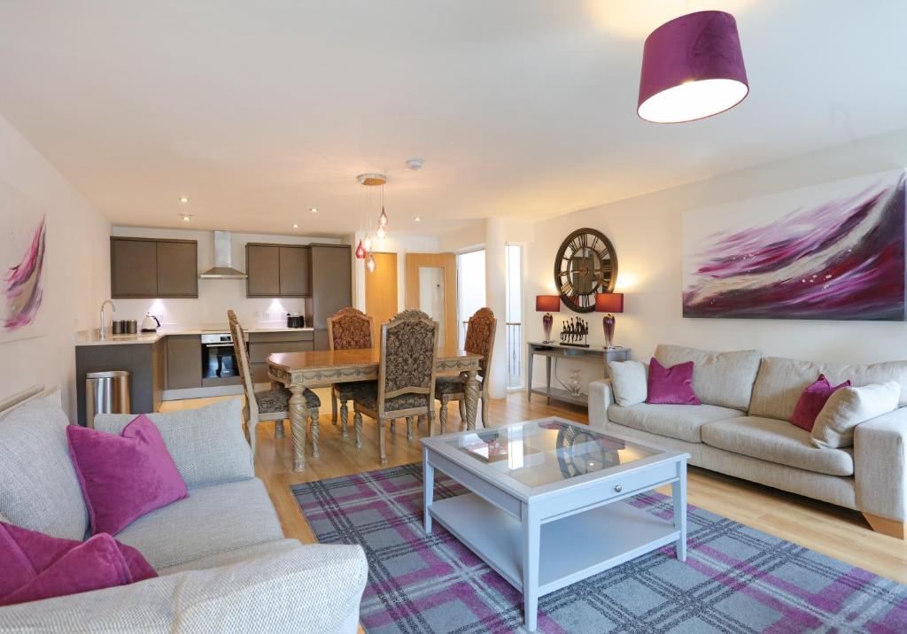 a living room with a couch and a table at The Shandwick Place Residence No 2 in Edinburgh