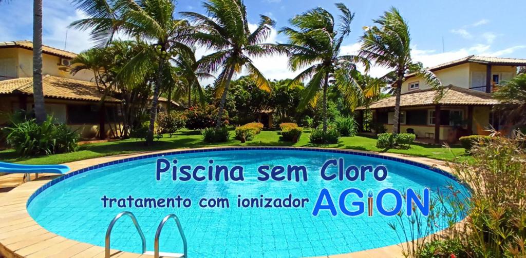 een zwembad voor een villa bij Grimms Pousada de Contos in Porto de Sauipe