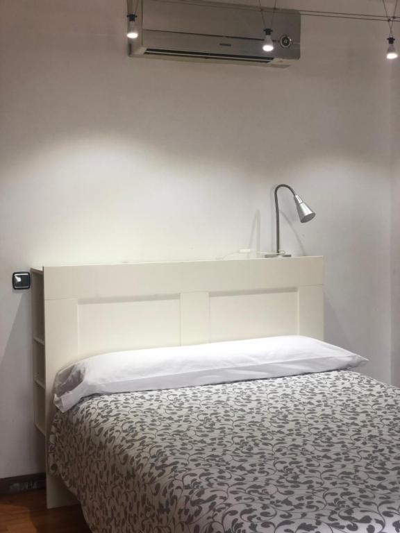 Posteľ alebo postele v izbe v ubytovaní Apartamento Gran Comedias