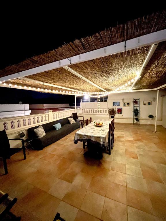 a large living room with a table and chairs at Relax House in Bari