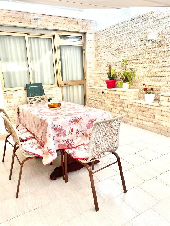a table and two chairs on a patio at Relax House in Bari