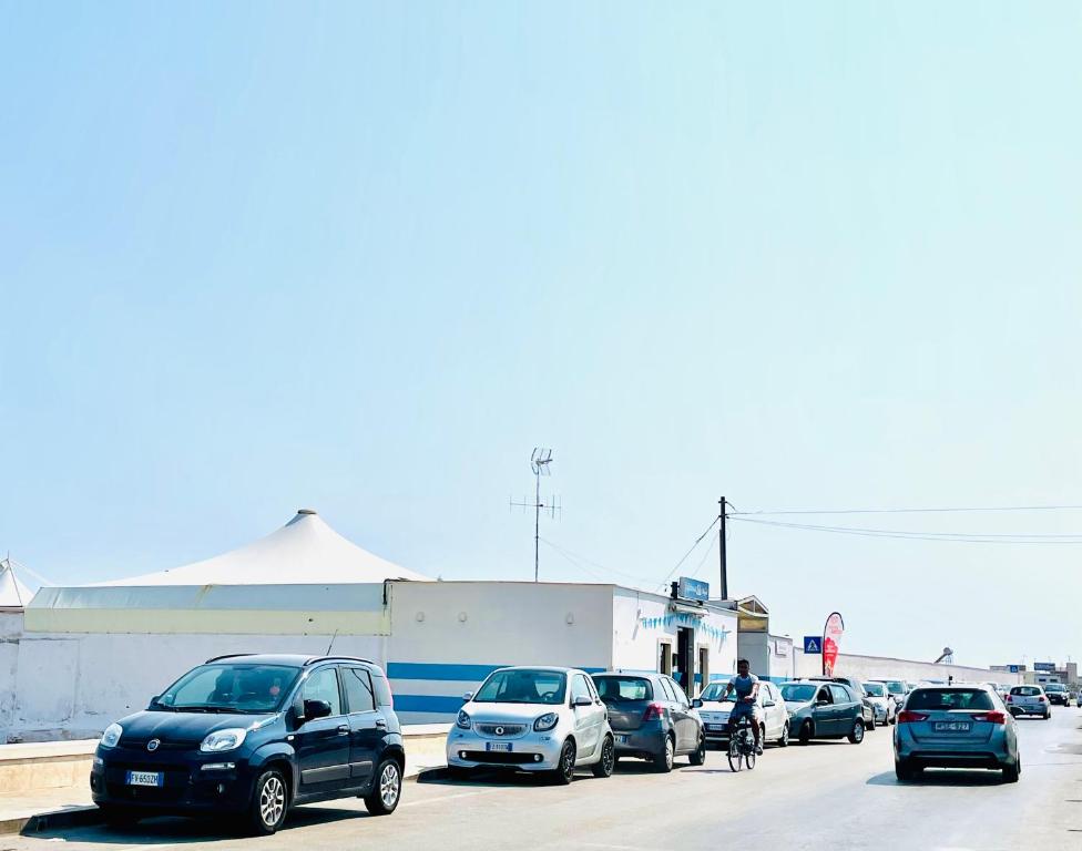 a group of cars parked in a parking lot at Relax House in Bari