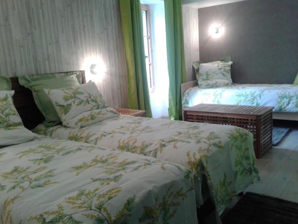 Postel nebo postele na pokoji v ubytování Le Manoir du Butel