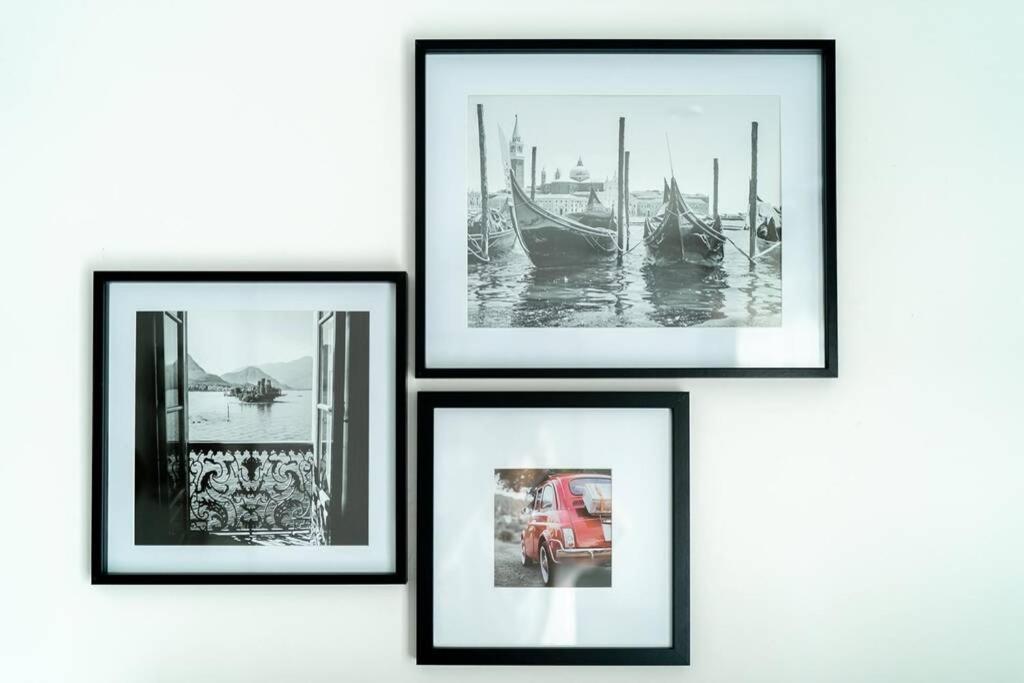 four framed pictures of boats on a wall at La Villetta G Blotzheim - Appartement de Standing in Blotzheim