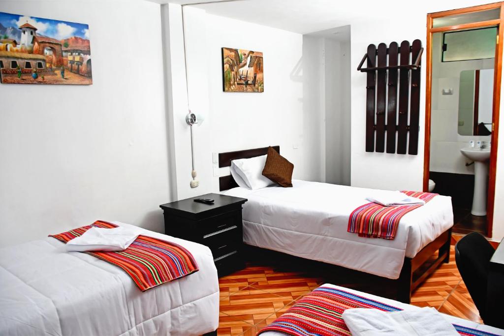 Postel nebo postele na pokoji v ubytování Peru Coca B&B Machupicchu
