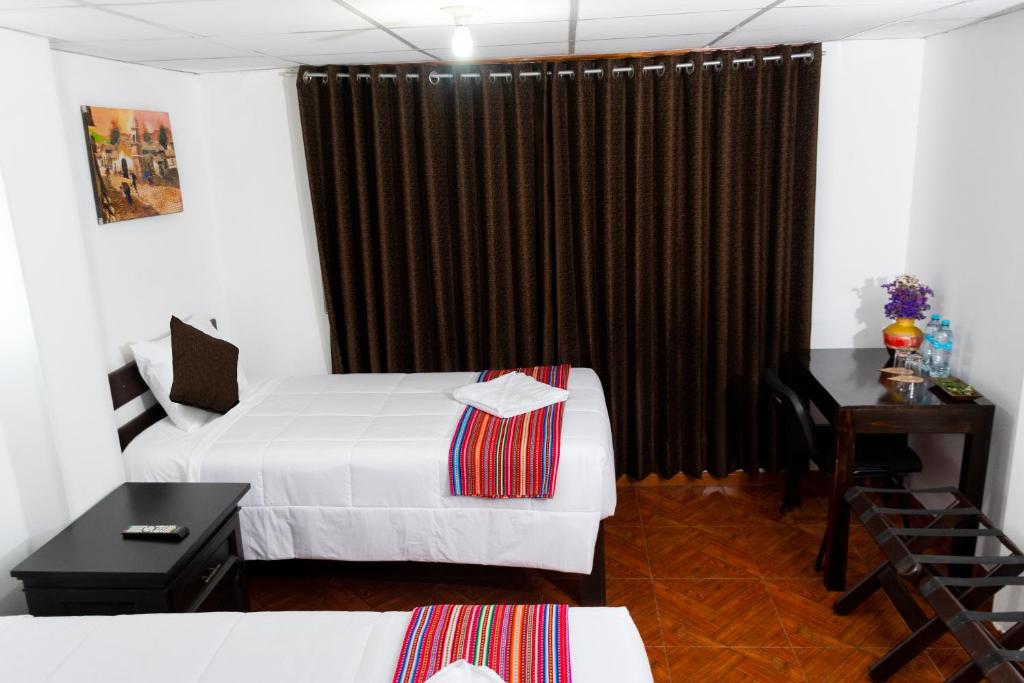 Postel nebo postele na pokoji v ubytování Peru Coca B&B Machupicchu