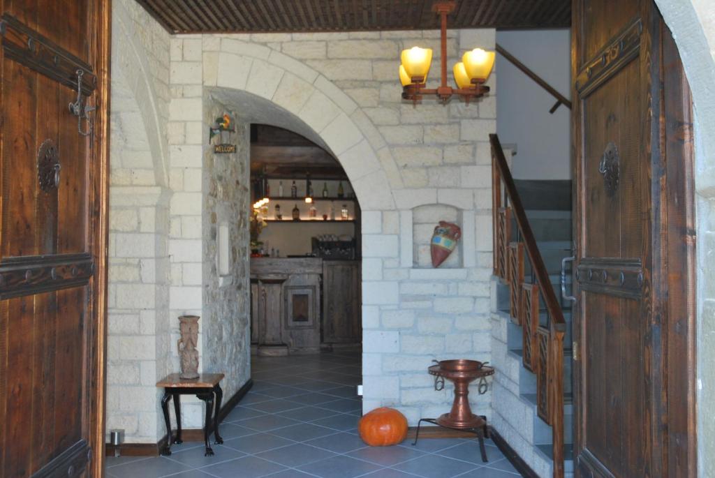 a hallway with an archway in a house at Hotel Klea in Berat