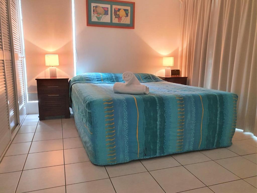 Postel nebo postele na pokoji v ubytování Mango Tree Holiday Apartments
