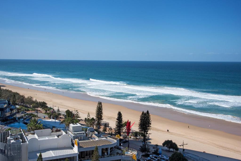 an aerial view of a beach and the ocean at Allunga Stunning Beach Side Apartment in Gold Coast