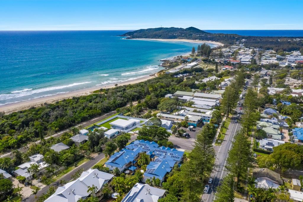 an aerial view of a beach with houses and the ocean at Eco Beach Resort in Byron Bay