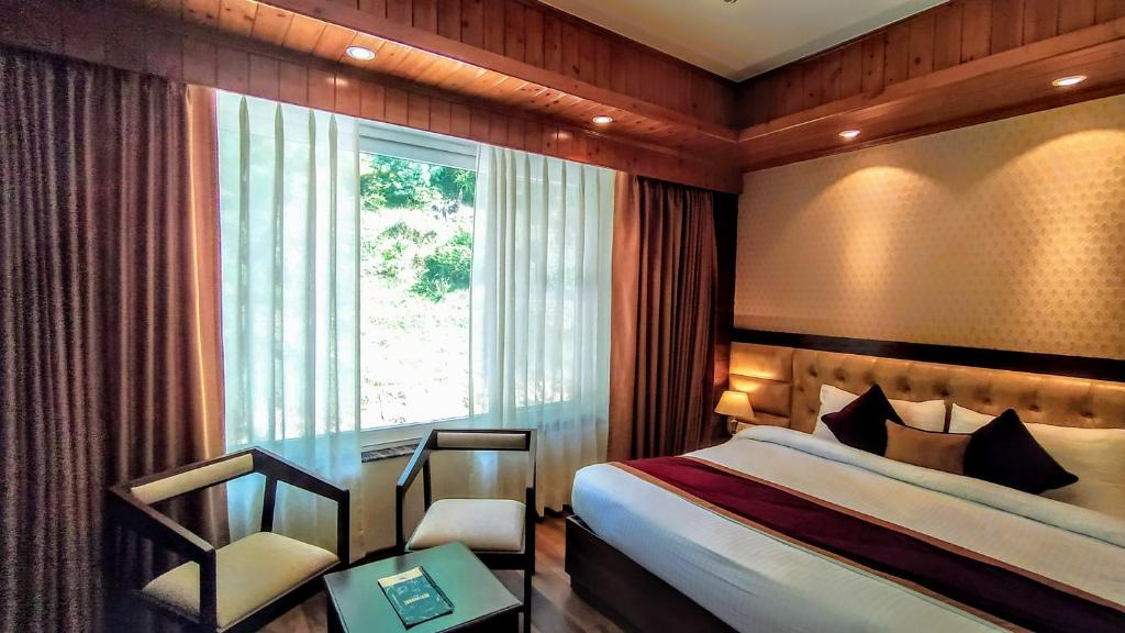 Postel nebo postele na pokoji v ubytování The Retreat Mashobra, Shimla
