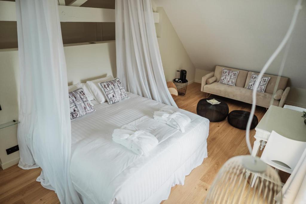 Postel nebo postele na pokoji v ubytování Maison Durieux