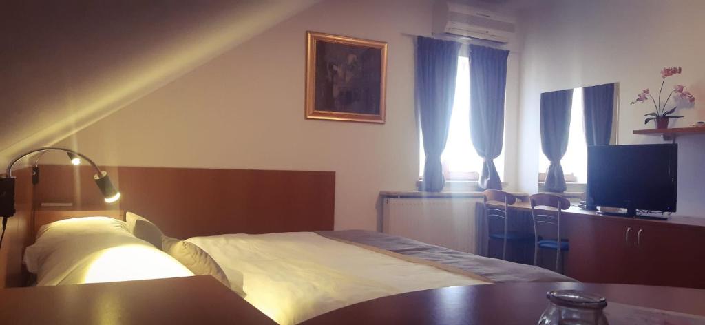 Postel nebo postele na pokoji v ubytování Pansion Danica