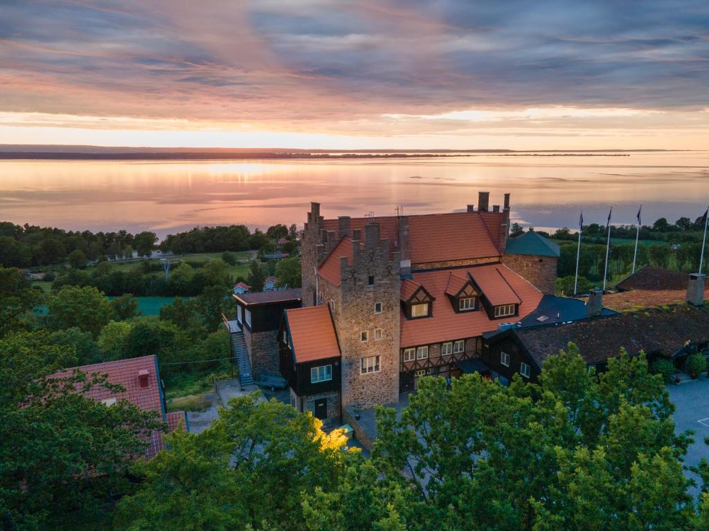 an aerial view of a castle on the water at Hotel Gyllene Uttern in Gränna