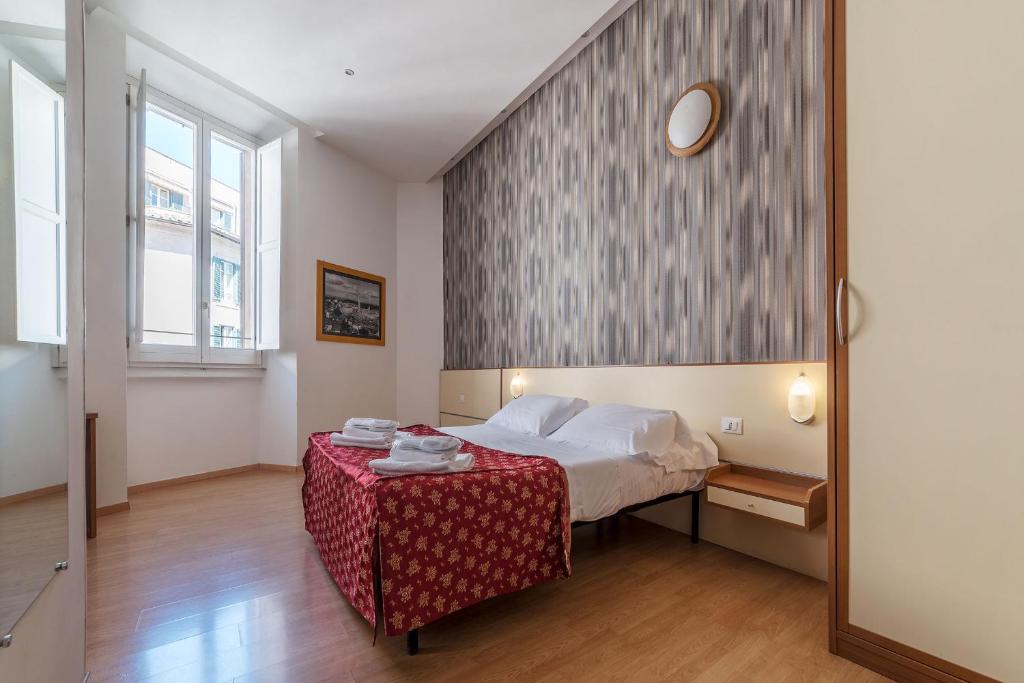 Postel nebo postele na pokoji v ubytování Hotel Mimosa Pantheon