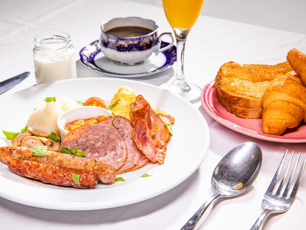 a plate of food with meat and eggs and toast at APA Hotel Kintetsu Nara Ekimae in Nara