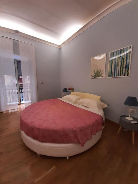 Säng eller sängar i ett rum på Pignasecca Home