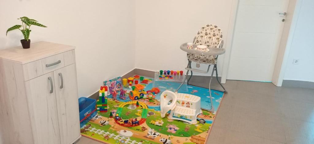a lego play set on the floor in a room at Appartement Carpe diem vue mer in Herceg-Novi