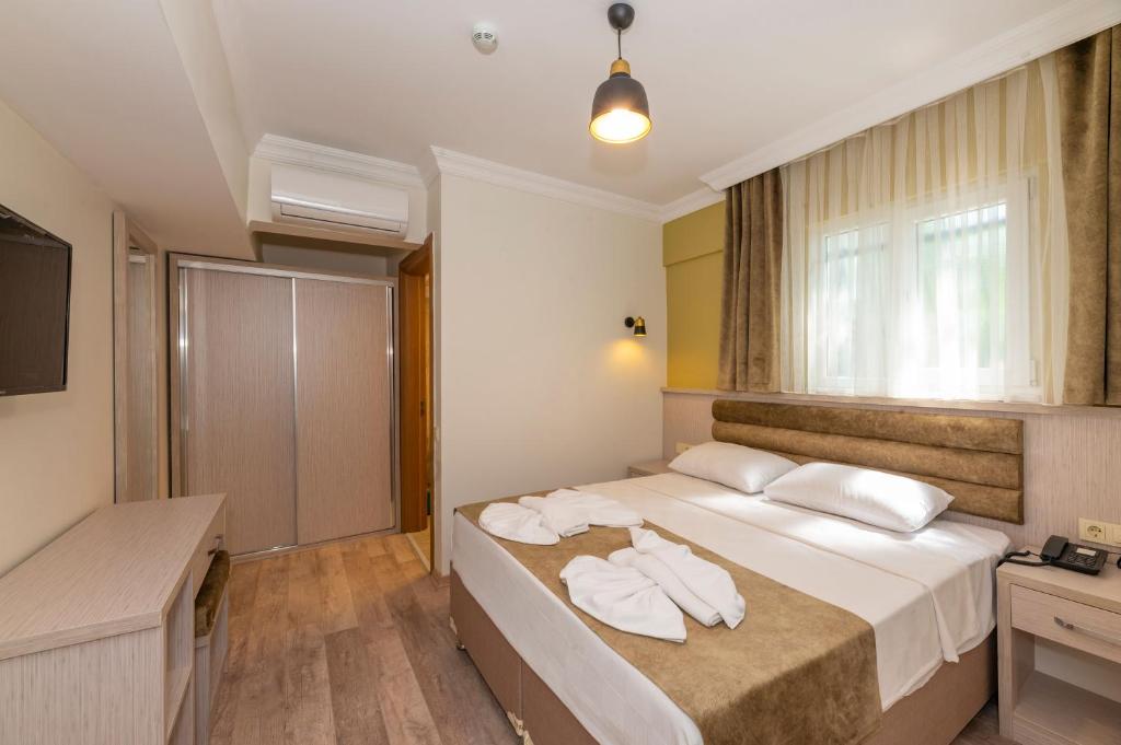 Кровать или кровати в номере Bazaar Hotels Old City