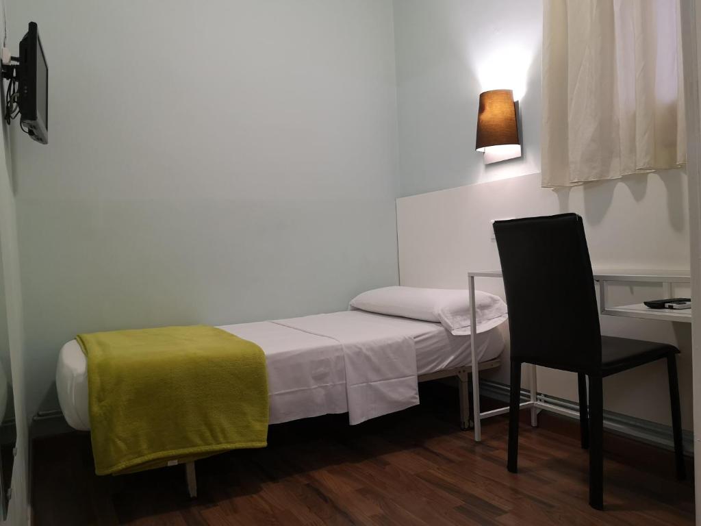 Posteľ alebo postele v izbe v ubytovaní Hostal Lesseps