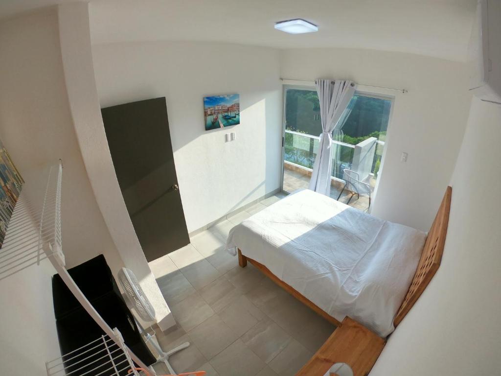Postel nebo postele na pokoji v ubytování Boca PentHouses - Tampiquera